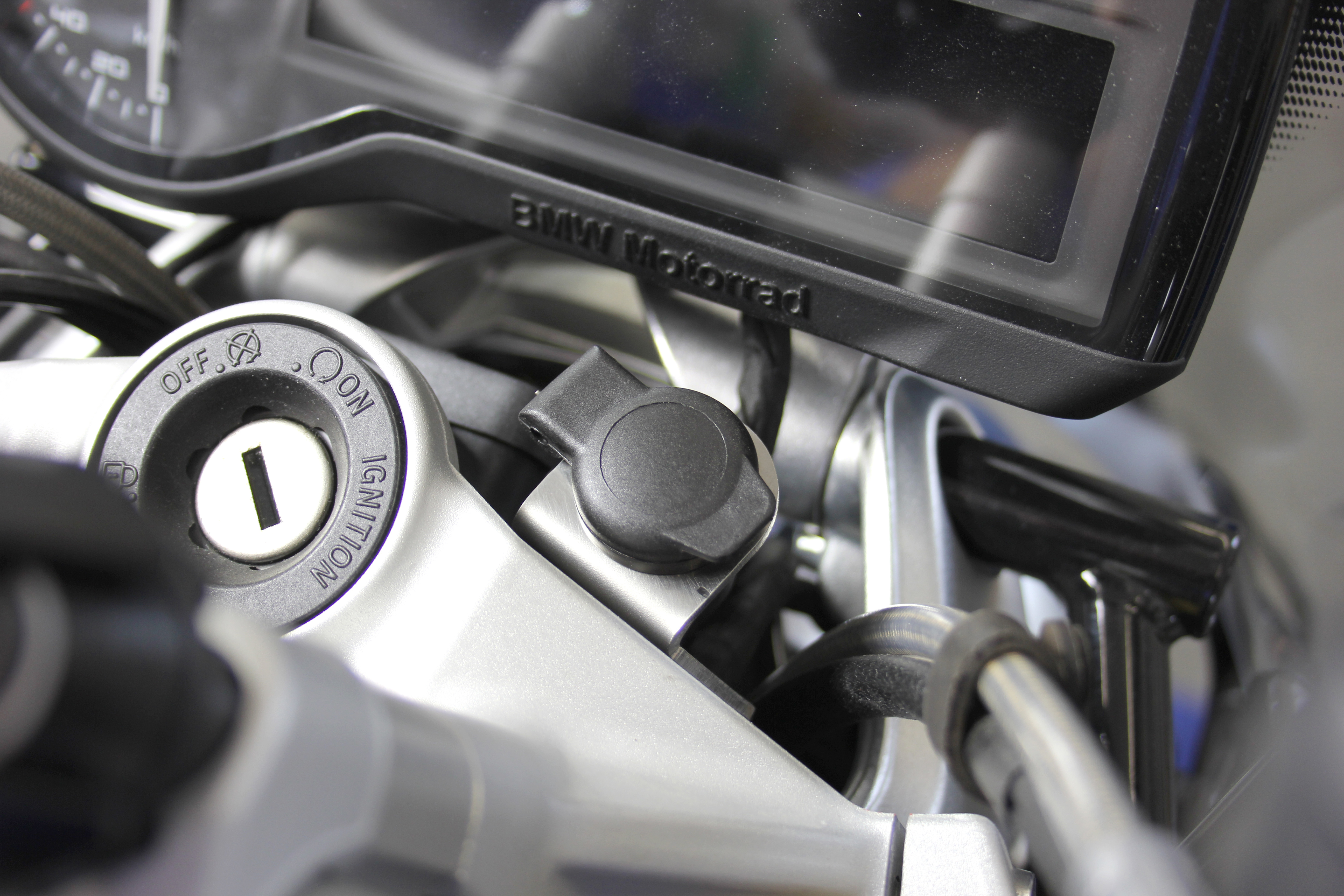 Holder for on-board socket for BMW R 1250 R